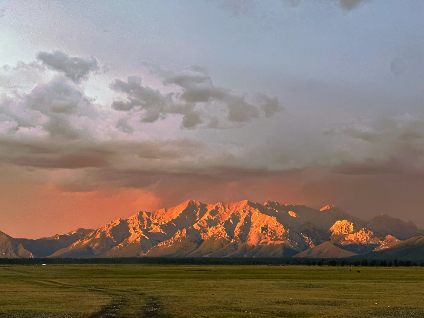 Alpenglow on a snow range at dusk