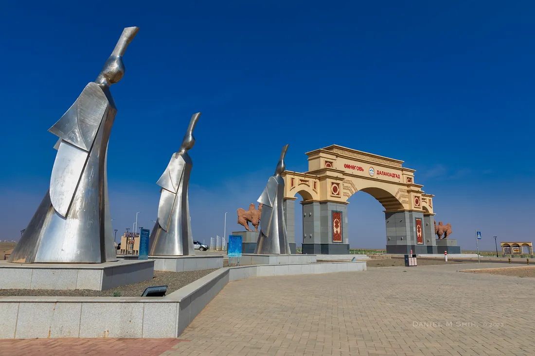 The entrance arch of Dalanzadgad, with steel sculptures of the 3 desert queens
