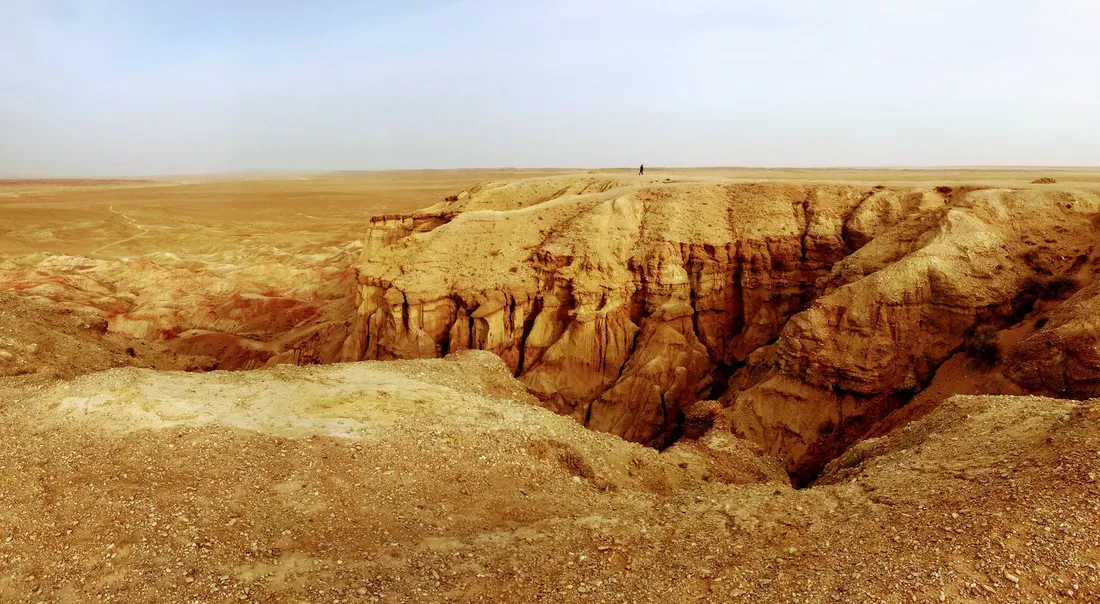 An eroded canyon in the open desert