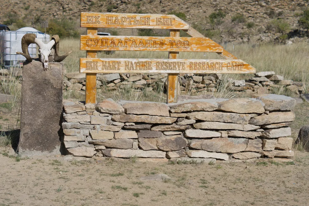 The entrance sign of the Ikh Nart research camp.