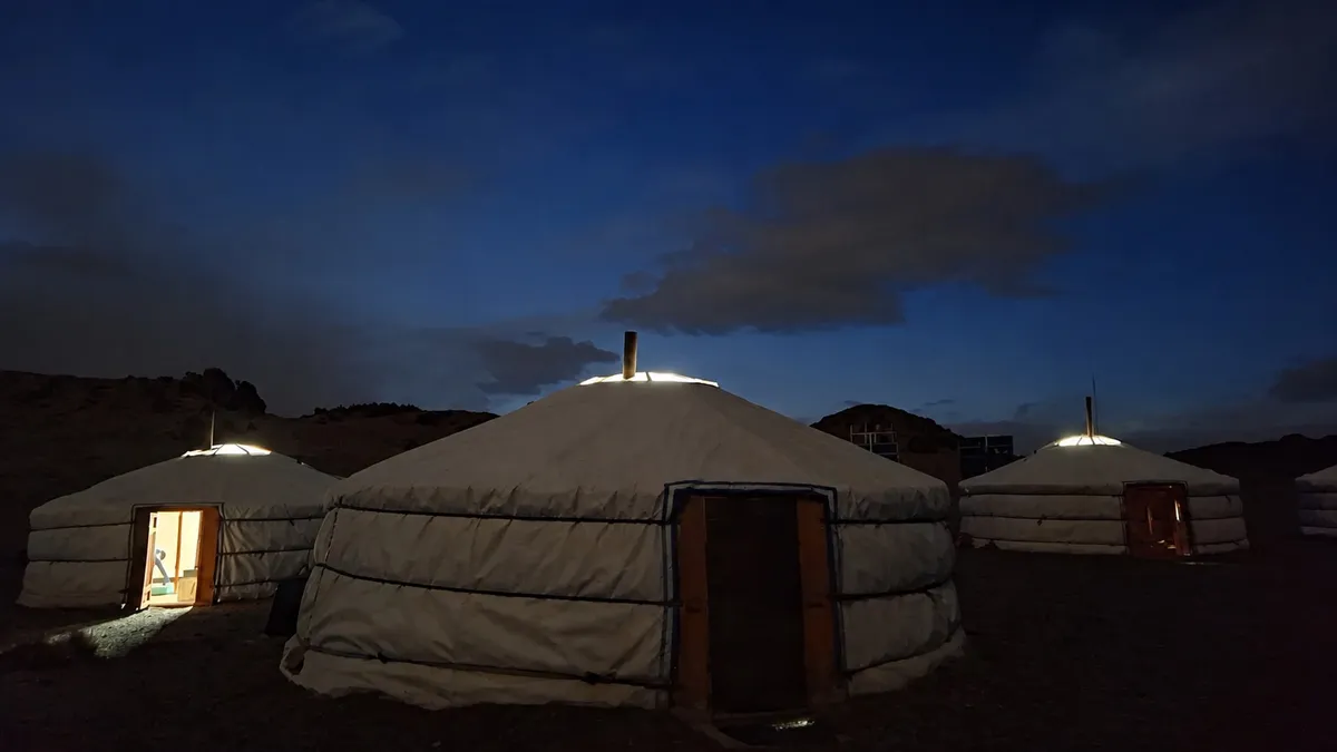 Lit gers at the Tost research centre after dark